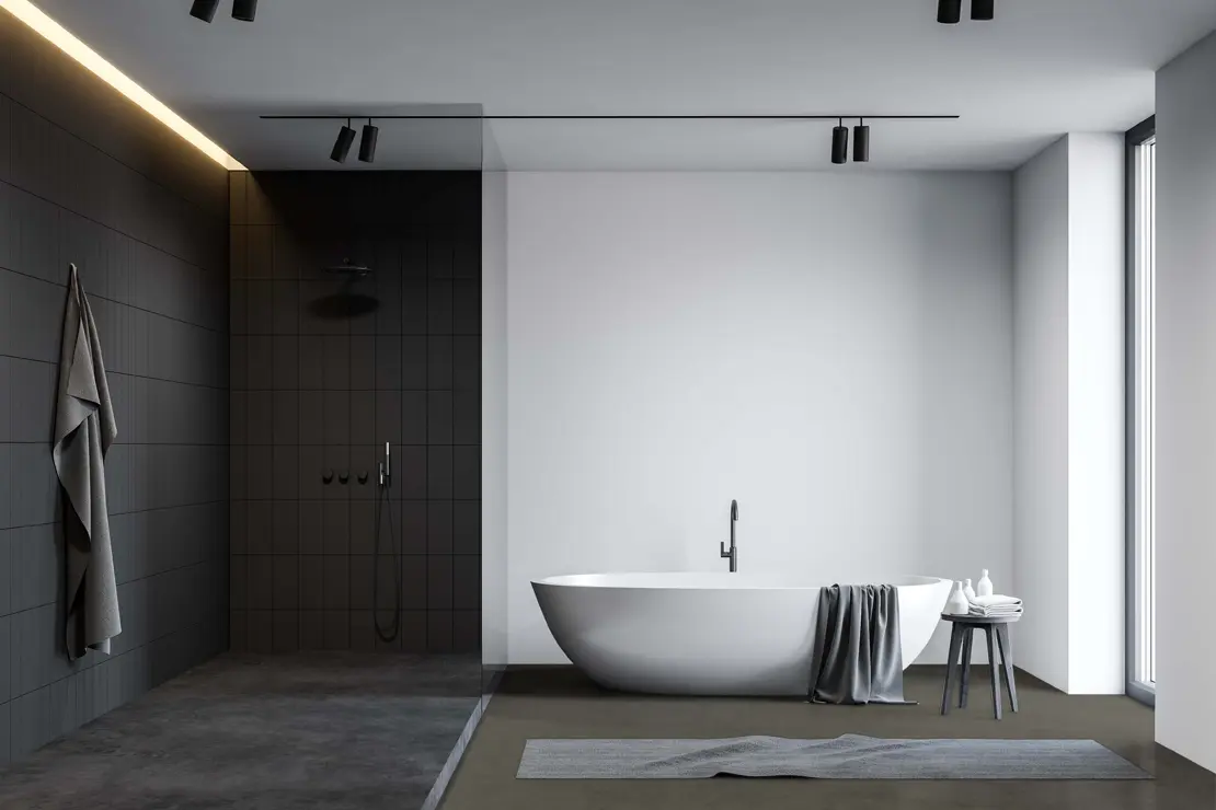 Douche avec sol en béton ciré de couleur gris foncé Douche avec sol en béton ciré de couleur gris foncé